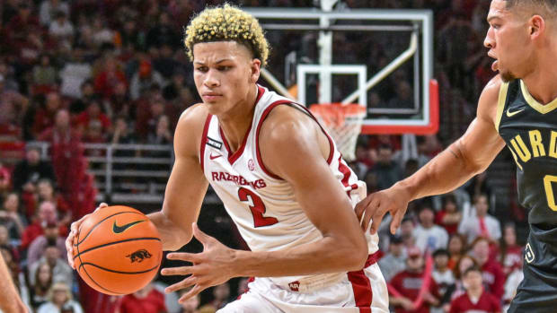 Razorbacks' Trevon Brazile drives against Purdue in exhibition game Saturday.